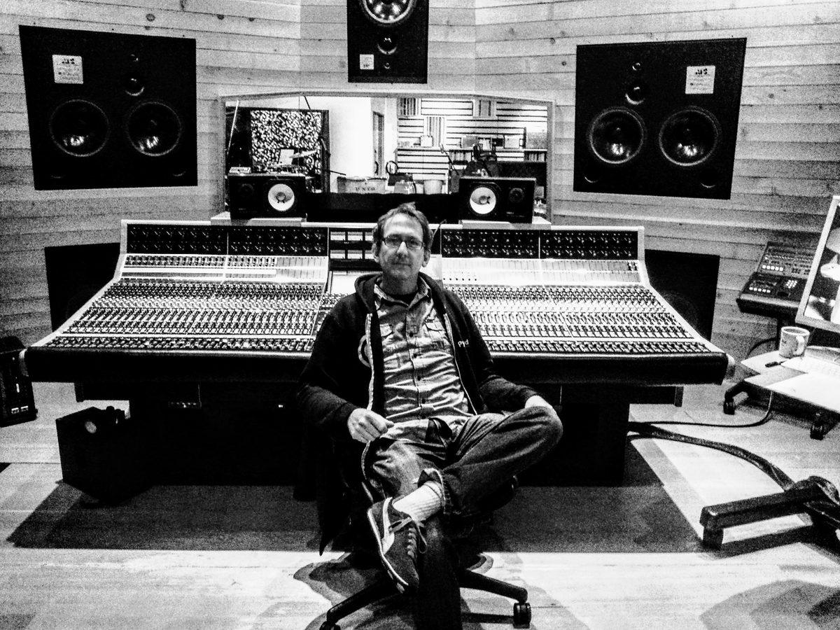 Matt Boudreau sitting in front of the console at 25th Street Recording.